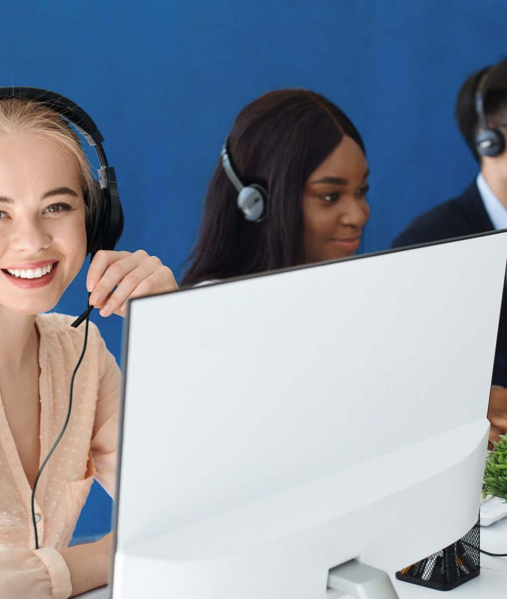 joyful-customer-service-agents-with-headphones-communicating-with-clients-at-call-center.jpg